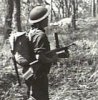 Australian military training: firing an Owen gun while advancing.