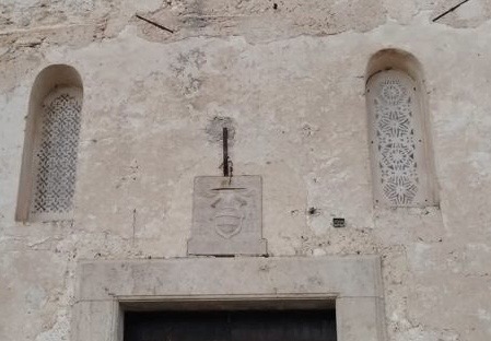 Coat of arms of the House of Carafa above the entrance of the church of St. Peter Alli Marmi.