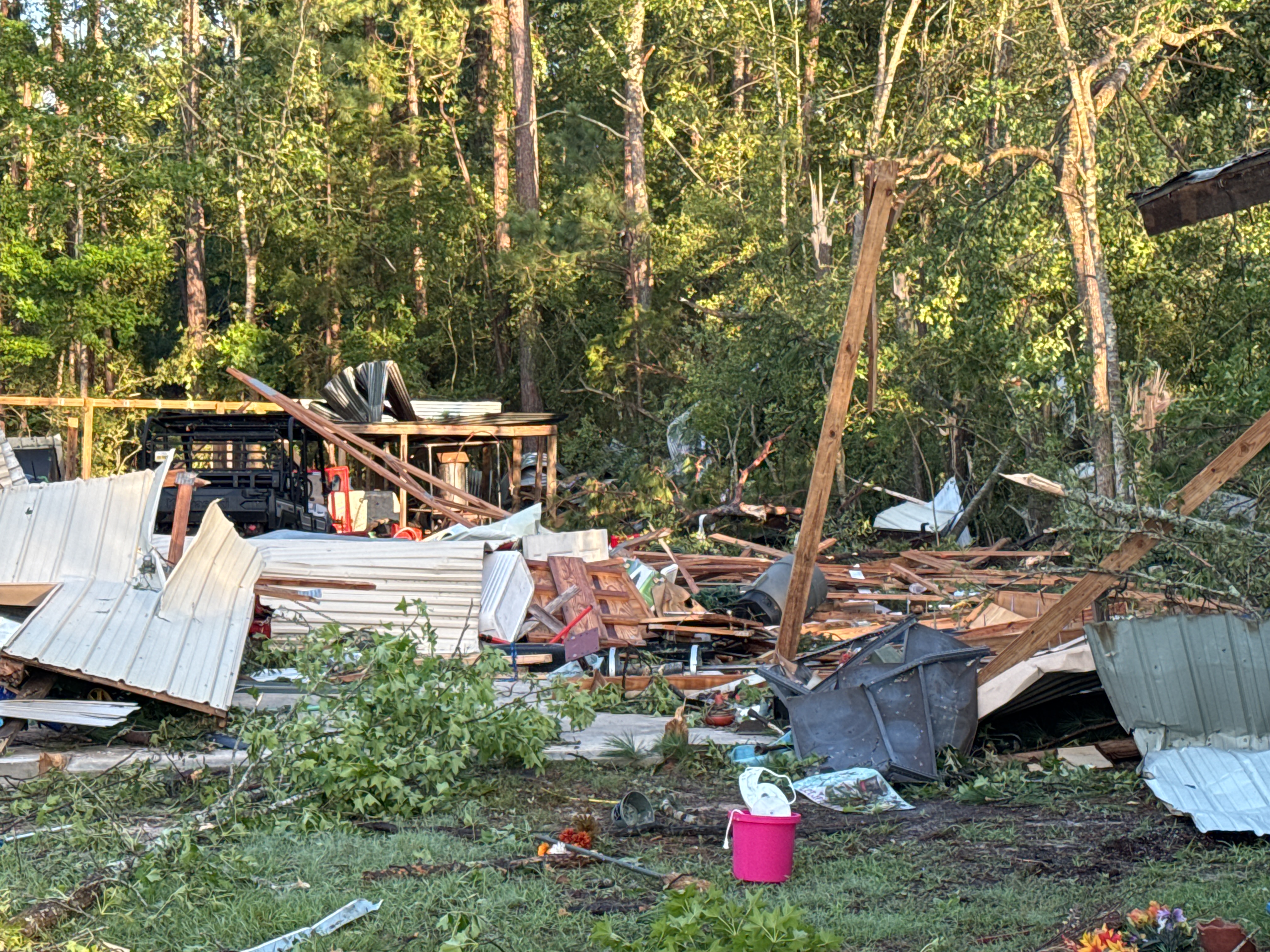 EF2 damage to trees and a destroyed outbuildings on the southwest side of Jasper, Texas.