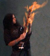 Desimo's guitar on fire.