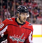 Ice hockey player in a red Washington Capitals jersey