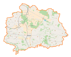 Mapa konturowa powiatu miechowskiego, blisko centrum na lewo u góry znajduje się punkt z opisem „Tunel pod Białą Górą”