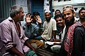 Bangladeshi men smiling, Dhaka. by Steve Evans