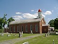 St. Alphonsus Catholic Church; the monument is in front of the church in this picture