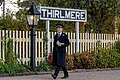 Thrilmere Station Sign with uniformed volunteer