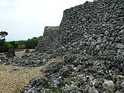 The cobbled walls of a stone castle