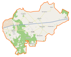 Mapa konturowa gminy Kuślin, blisko centrum u góry znajduje się punkt z opisem „Trzcianka”