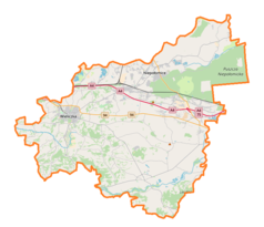 Mapa konturowa powiatu wielickiego, blisko centrum u góry znajduje się punkt z opisem „Niepołomice”