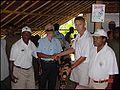 Albinistic former Solomon Islander militant leader Stanley "Sataan" Kaoni surrenders weapon to NZ forces after ceasefire. Source: New Zealand Defense Force press release, June 5, 2002