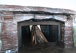 Fireplace in the Kehlsteinhaus, a present from Mussolini (The three central stones were chipped by Allied souvenir hunters.)[24]