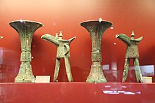 Two bronze goblets and two bronze pouring vessels