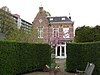 Blokvormig huis van twee bouwlagen (voormalige Koetshuis van dokterswoning)