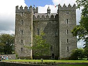 A big tower house with square corner towers.