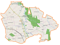 Mapa konturowa gminy Milejów, blisko prawej krawiędzi znajduje się punkt z opisem „Dąbrowa”