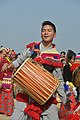 A Rai man playing traditional drum (Dhol)