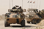 Two ASLAVs in Iraq during the transition from the Al Muthanna Task Group to Overwatch Battle Group (West)