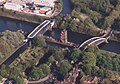 The swing aqueduct in the closed position, showing the Bridgewater Canal crossing over the Ship Canal. The Barton Road Swing Bridge is on the right.