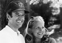 Photo of Biden and his wife smiling, dressed casually