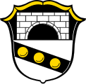 Gemeinde Bruck Geteilt von Schwarz und Silber; oben eine silberne Brücke, unten ein schwarzer, mit drei goldenen Kugeln belegter Schrägbalken.