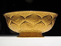 Tang era gilt-gold bowl with lotus and animal motifs