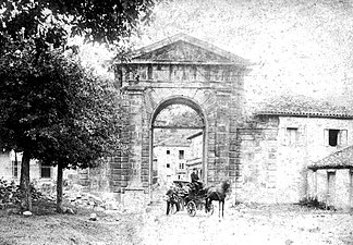 The gate of Curtius's La Cavada factory in Cantabria, Spain (1890) .