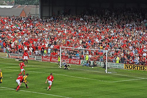 Ryan Valentine scores a penalty for Wrexham to keep them in the Football League