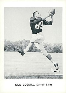 Gail Cogdill in a Detroit Lions uniform, with no helmet, catching a football.