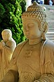 A statue of the Buddha with a swastika (Indian good luck symbol) on his chest.