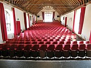 The original 15th-century wooden roof is visible inside the auditorium that once hosted Shakespeare