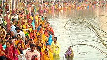 People gathered at a pond in Janakpur, Nepal to worship Surya, the sun god and his consort Chhathi Maiya (2008)