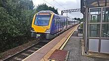 A Northern class 195 at Mossley Hill bound for Manchester Oxford Road