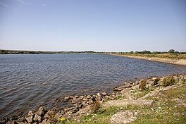 Image of a lake with a rocky foreshore