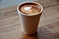 A cortado in a disposable foam cup