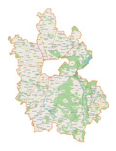 Mapa konturowa powiatu piotrkowskiego, po lewej znajduje się punkt z opisem „Radziątków”