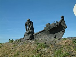 Monument "Dubbeltje op zijn kant" van de Twee Gebroeders op de dijk