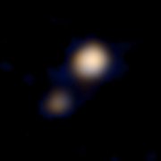 Plüton ve Charon'un elde edilen ilk renkli fotoğrafı (New Horizons).
