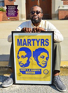 Eric Anthony Oliver, pictured with second of five pieces archived at National Museum of African American History & Culture Archives in Washington, D.C.