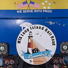 Close-up shot of the train's drumhead, featuring the train's name, branding, and a depiction of the Montauk Point Lighthouse