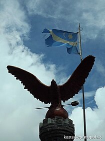 Turul statue with a Székely flag near at the peak of the Madarasi-Hargita (Harghita-Mădăraș), the holy mountain of the Székelys in Transylvania, Romania