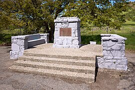 A monument at the base of the mountains indicating that John C. Fremont camped nearby