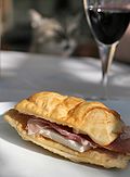 Crescentina served with cured meat and cheese