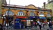 The interior of a building with windows on the ceiling and a railway track running from the background to the foreground in the centre