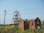 Coal mining shaft and a brick building