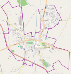 Mapa konturowa Nidzicy, blisko centrum po prawej na dole znajduje się ikonka zamku z wieżą z opisem „Zamek krzyżacki w Nidzicy”