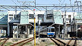 A view of the platforms. Note the station on the bridge above.