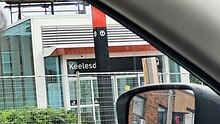 Photo of glass panelled subway station entrance