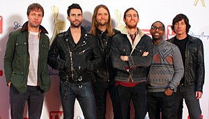 Maroon 5 in 2011 (from left to right: Mickey Madden, Adam Levine, James Valentine, Jesse Carmichael, PJ Morton, and Matt Flynn).