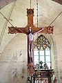Das 800 Jahre alte Kreuz der Kirche von Stenkumla auf Gotland zeigt die Entstehung des Namens (Christus triumphans): der Gekreuzigten trägt „Schuhe“ und Krone.