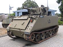 Colour photo of a green armoured fighting vehicle