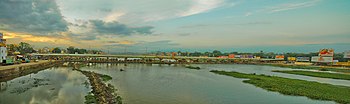 river with water flowing amidst weeds